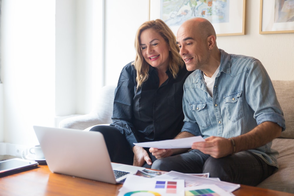 Australian couple reviewing investment information together at home